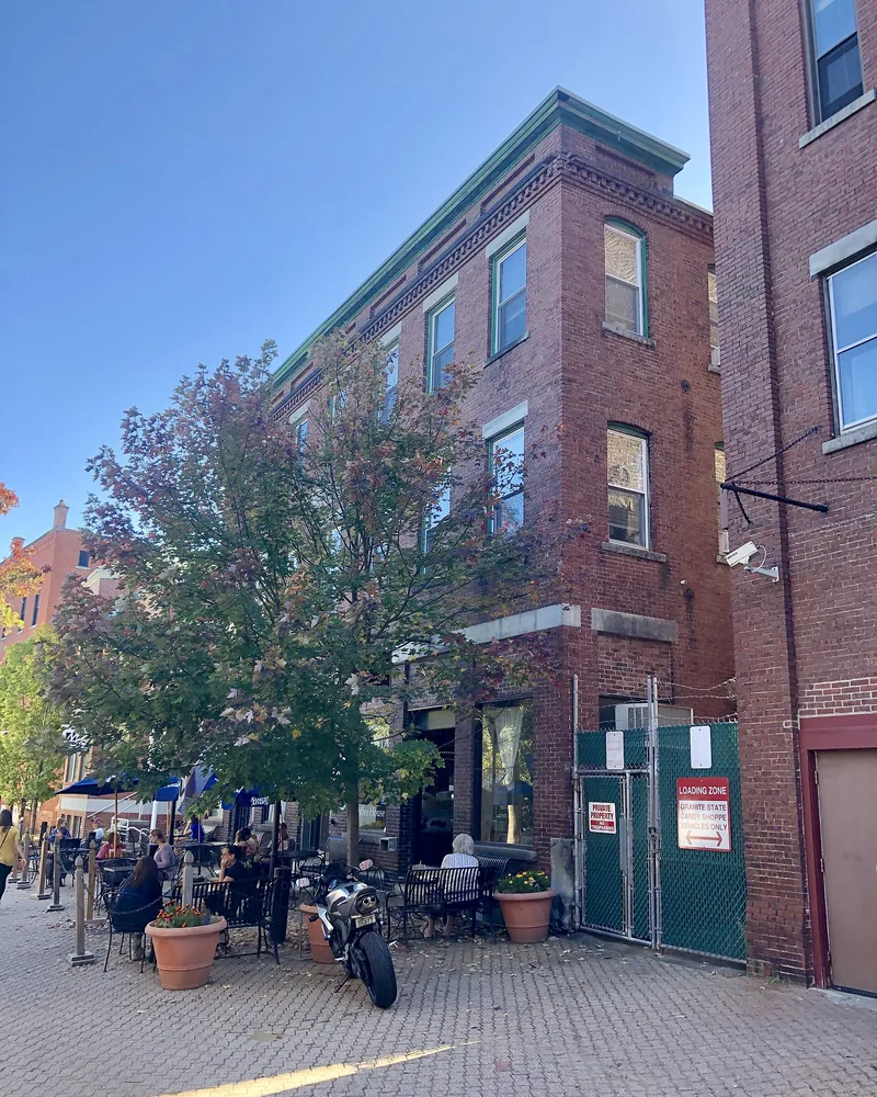 Brick storefronts around Bicentennial Square in downtown Concord